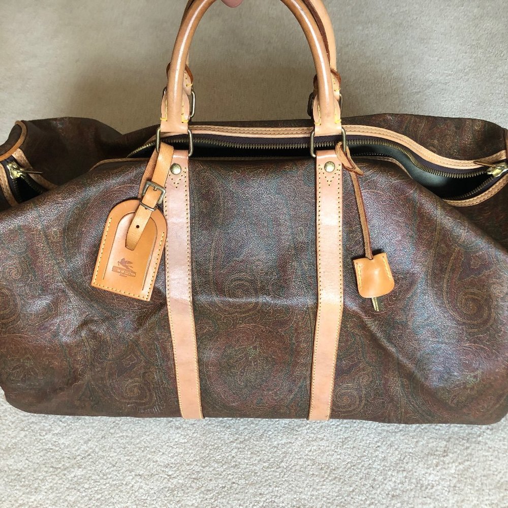 Etro paisley patterned leather duffel bag.